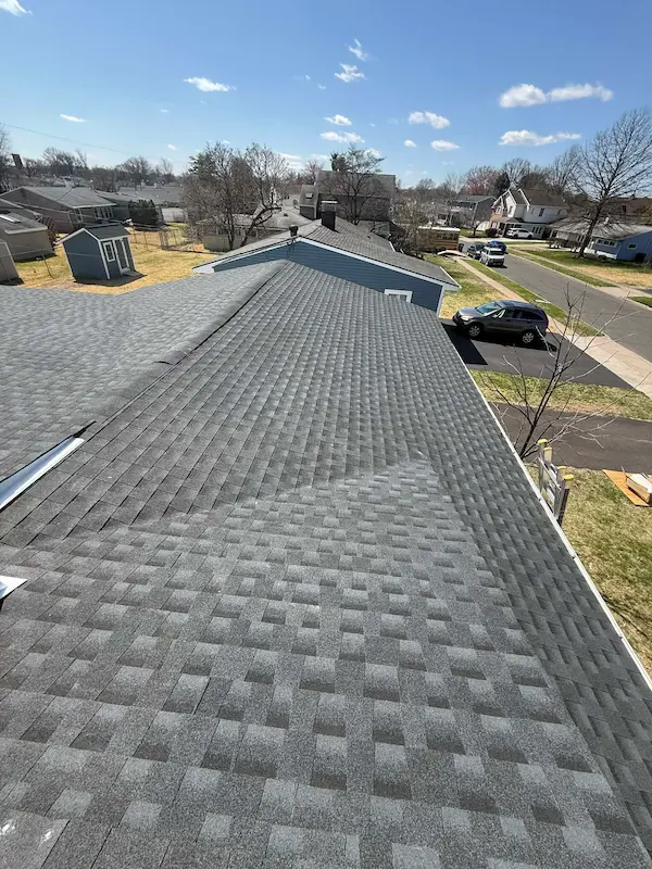 Freshly installed GAF shingles on a completed roof replacement by Right Deal Construction