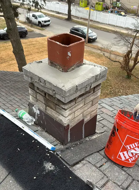 Close-up of deteriorating mortar joints on a brick chimney in Bucks County, PA